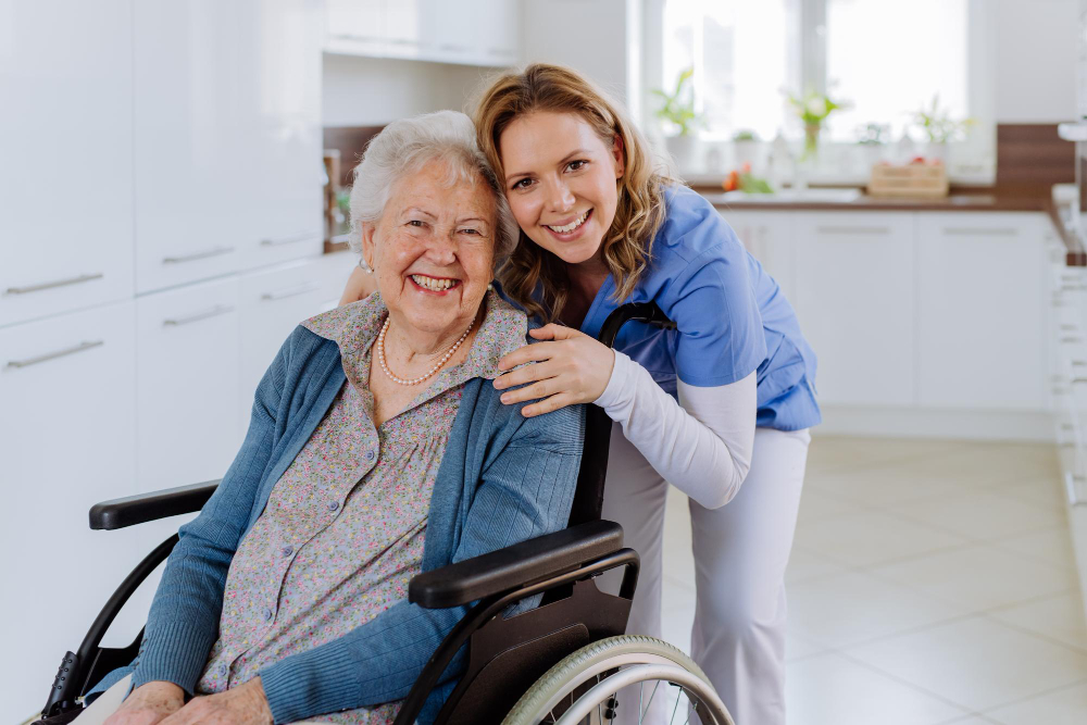 A caregiver supporting an older adult in a wheelchair