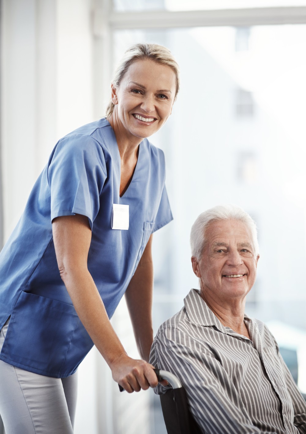 A caregiver supporting an older adult in Waterbury
